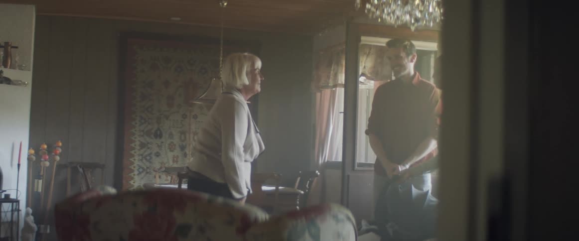 Grandmother meets grandson in a family visit at home