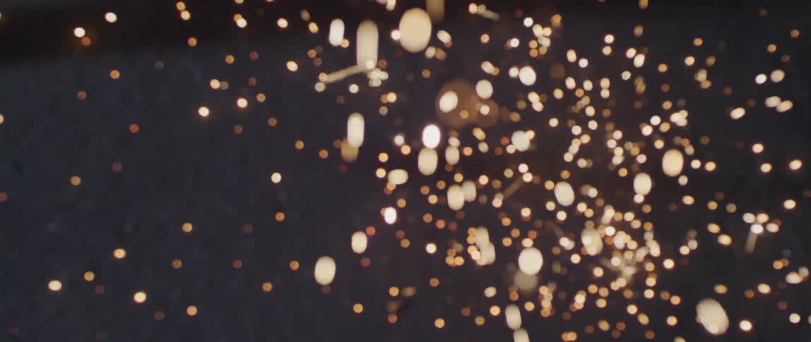 A floor with sparks and embers falling on it