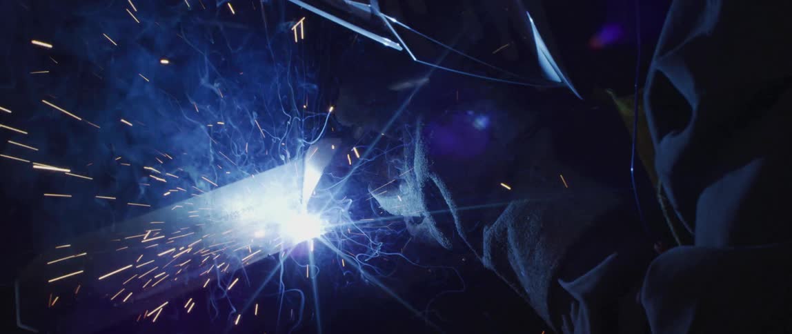 A person welding metal