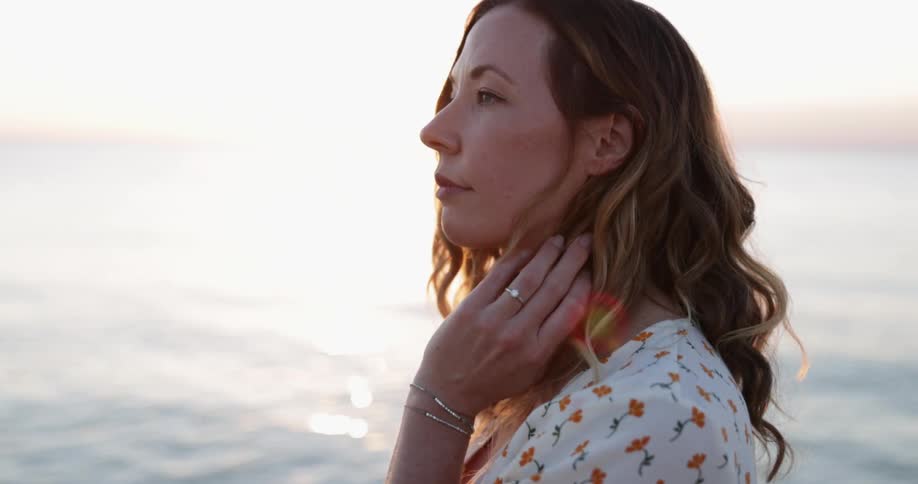 A woman standing near an ocean