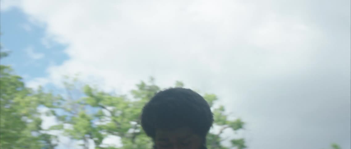 A man jumping in a neighborhood outside