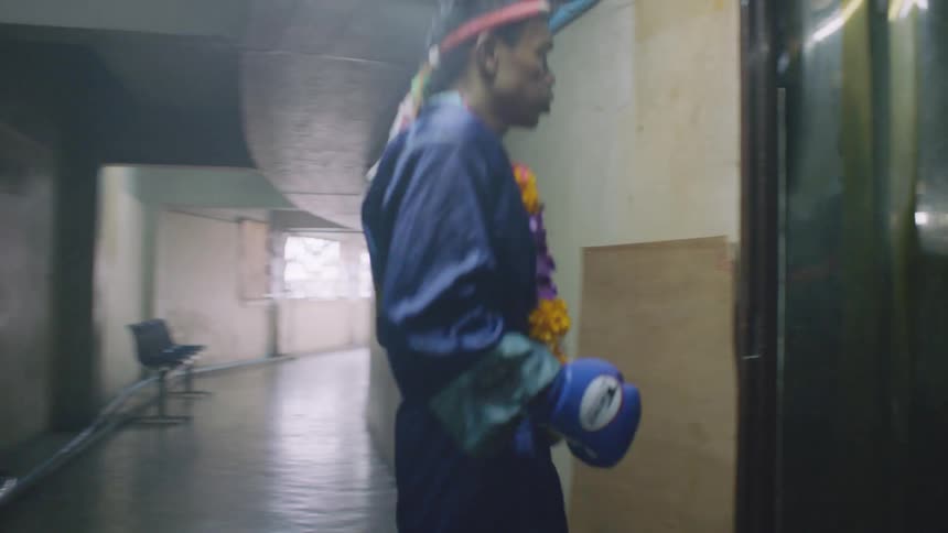 A man preparing to walk to a stage