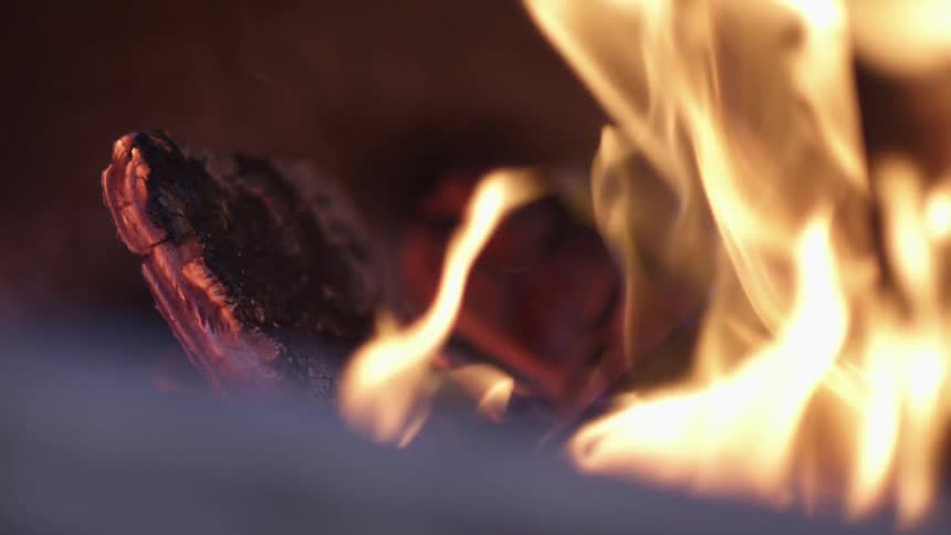 Fire burning wood and wavering flames
