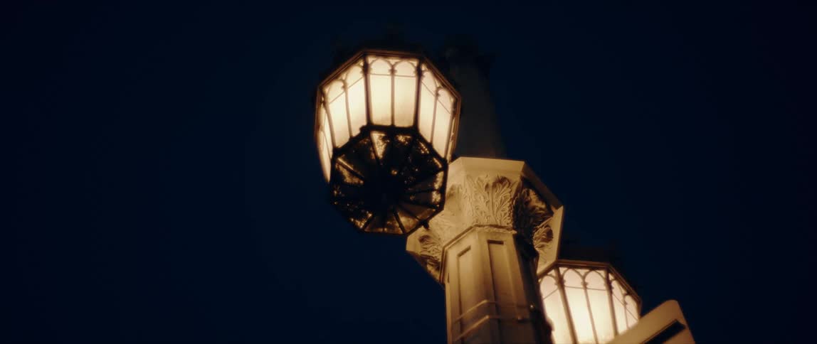 A building is displayed at night with lights