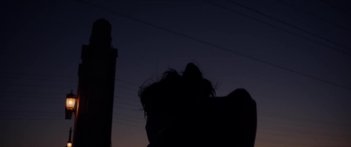 A woman dancing at night