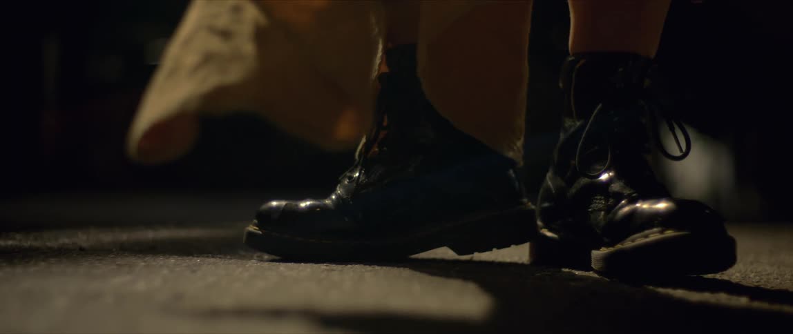 A close up of a persons boots