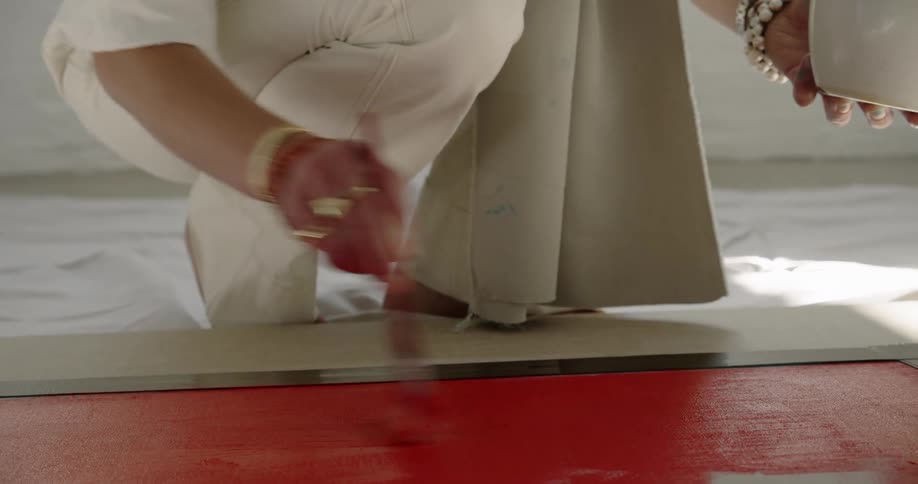 A person painting on a canvas