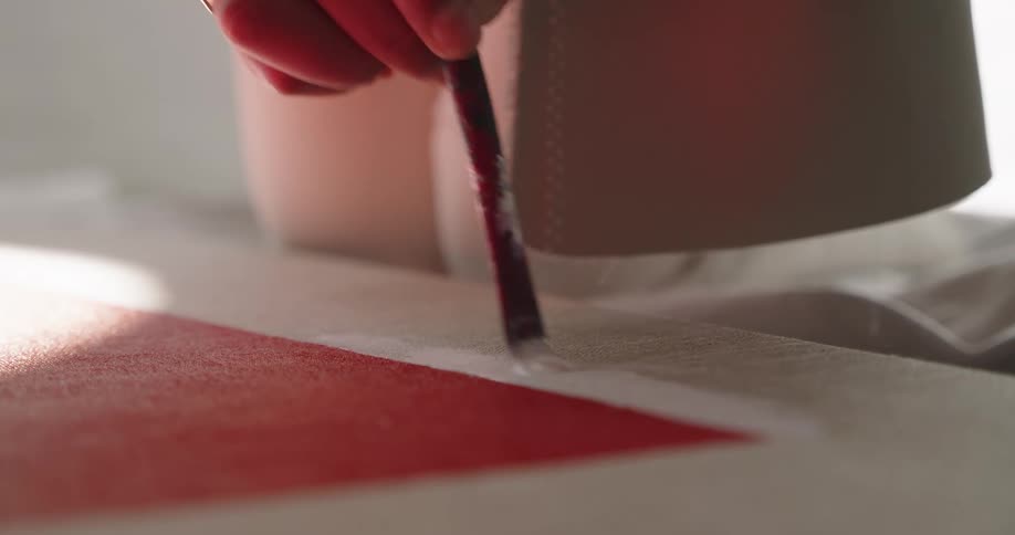A woman painting on a canvas