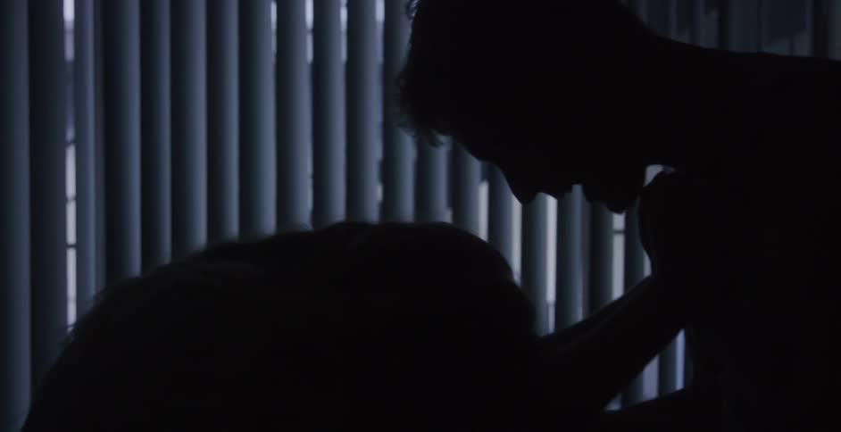 Man and woman quarreling with each other is silhouetted