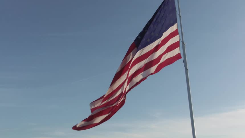 American flag on pole rippling in the wind