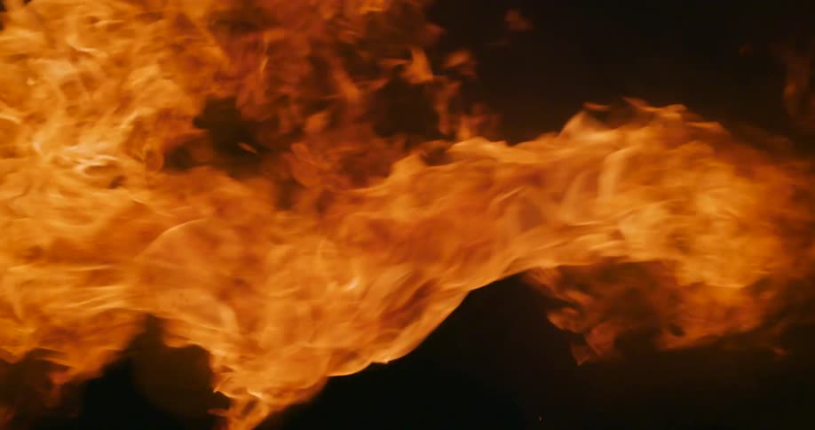 Flames outside as a fire burns at night