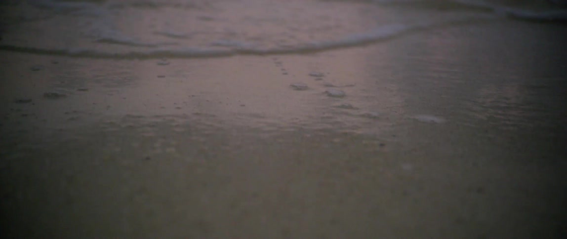 Ocean water is moving towards the coast of a beach