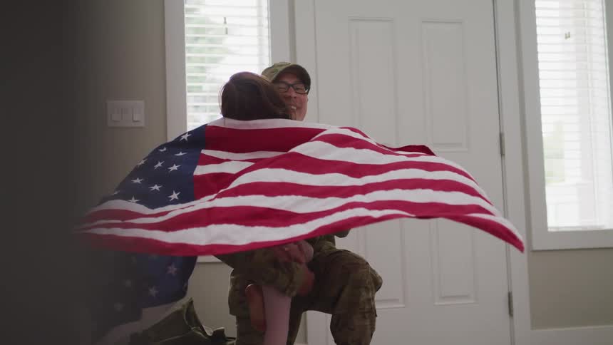 A military member returning home and his child coming to greet him