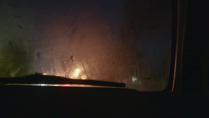 Inside of a car driving at night