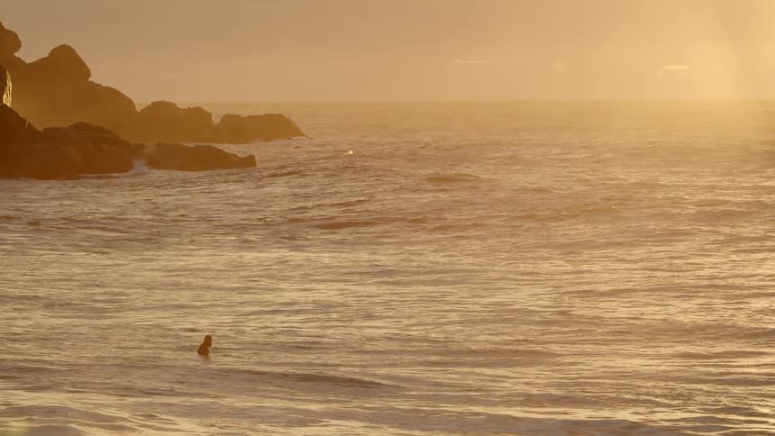 Wide shot of an ocean at dusk