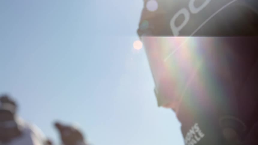 A man wearing goggles and face cover on a bright winter day