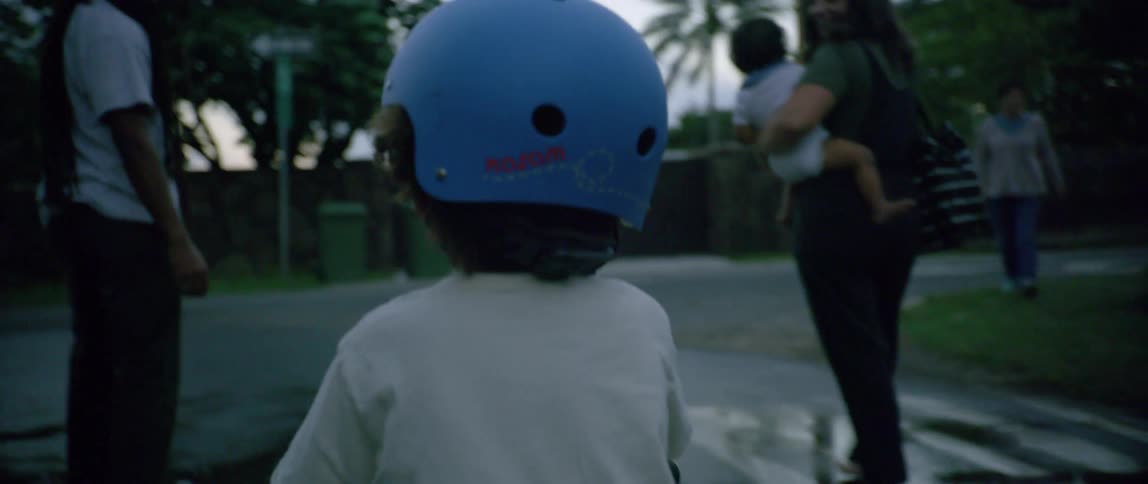 A child biking with his family