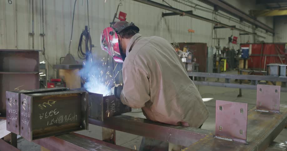 A man welding in a workshop