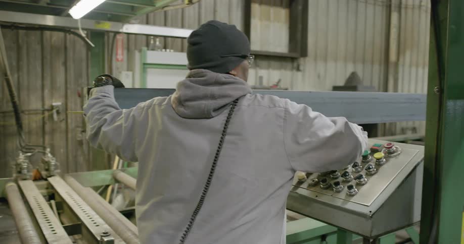 A man working with a chunk of metal