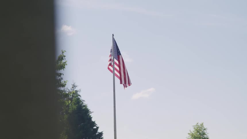 An american flag blowing in the breeze