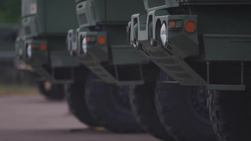 Vehicles parked with taillights wheels and tires