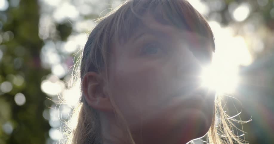 A woman standing and looking into the distance