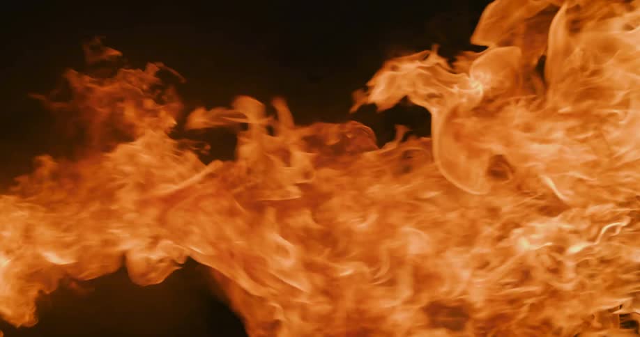 Fire flames blazing across the darkness