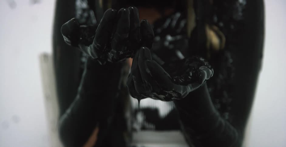 A person with black paint on their body