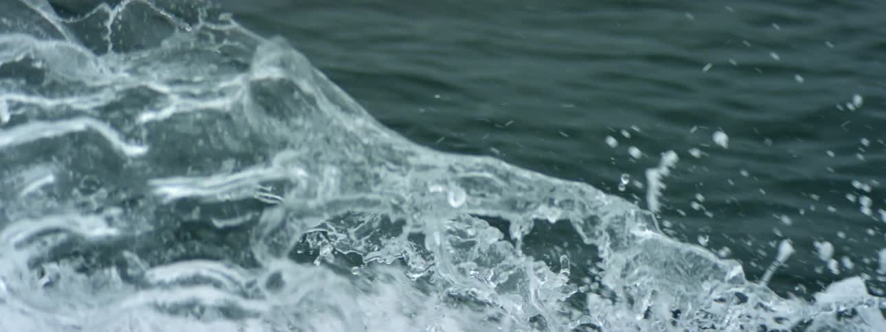 Small waves crash in the ocean