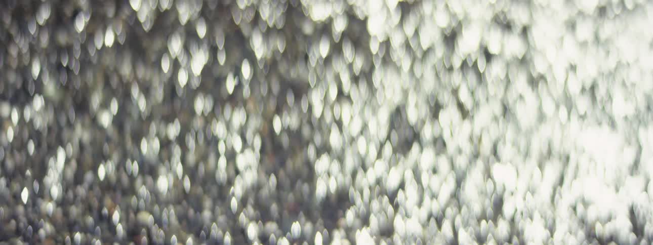 Shimmering flare of lights on a wet stone surface