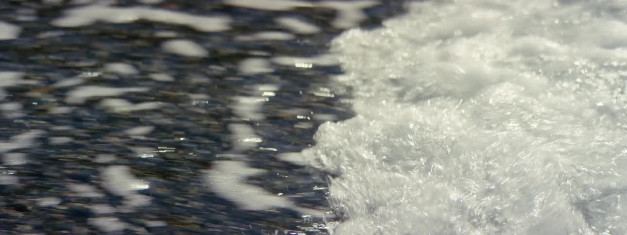 Ocean wave rushing onto the shoreline