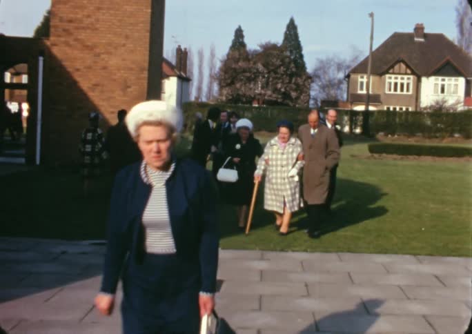 A group of people walking away from a church