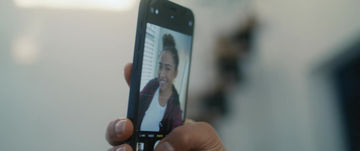 Teenager girl taking selfies on her smartphone