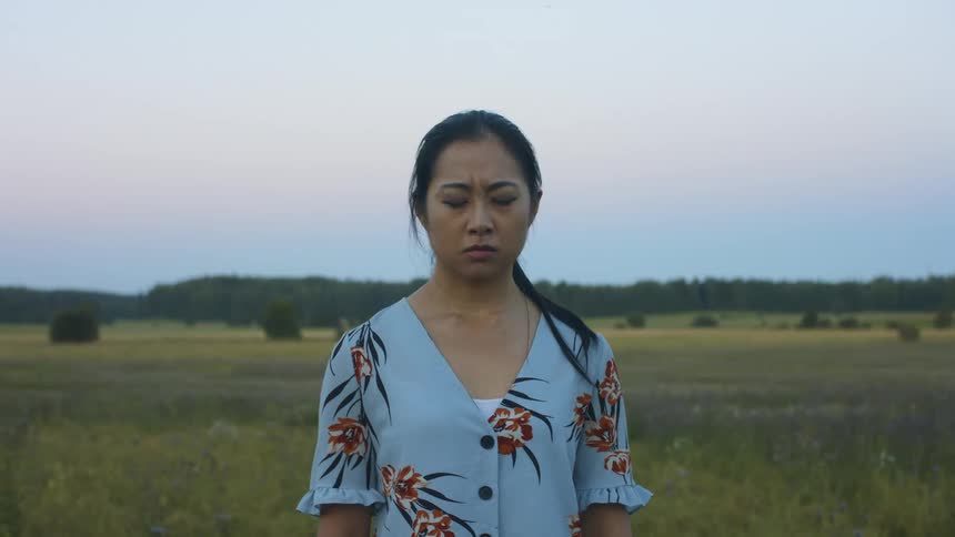 A woman is screaming outdoors in spring