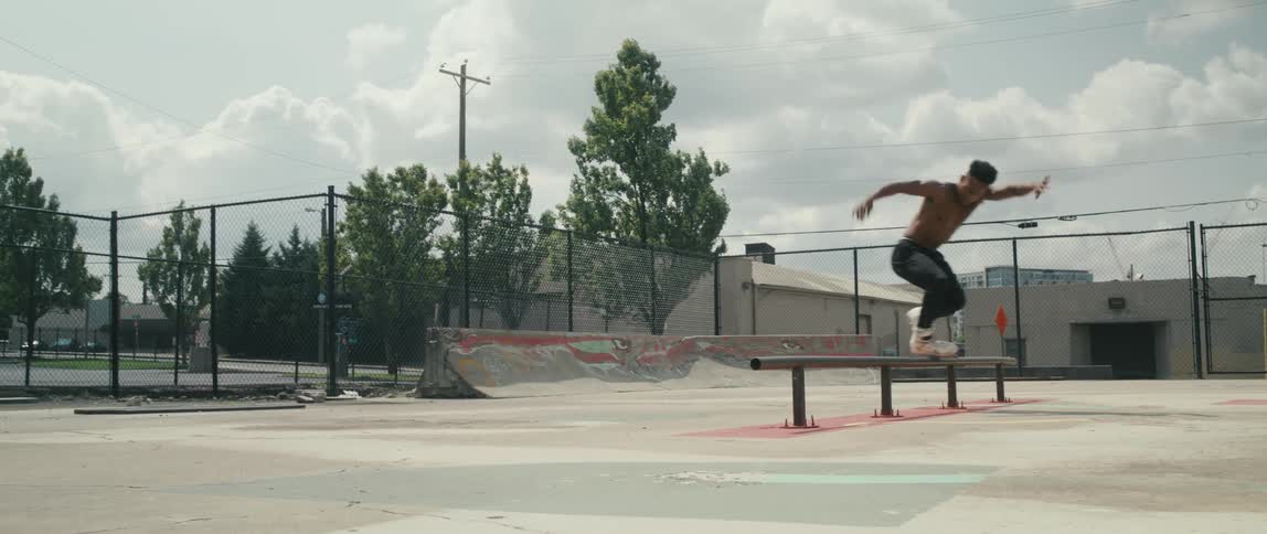 A man using roller blades at a skate park