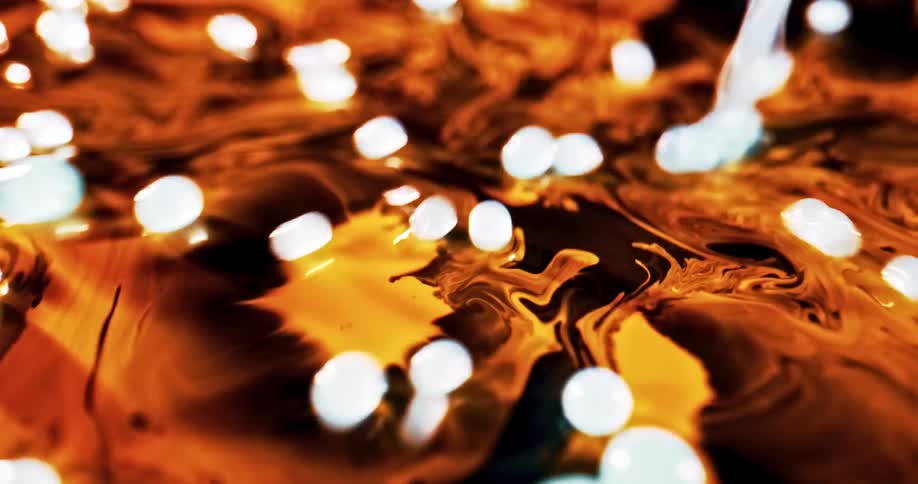 White black and orange colors that look like paint oil and water