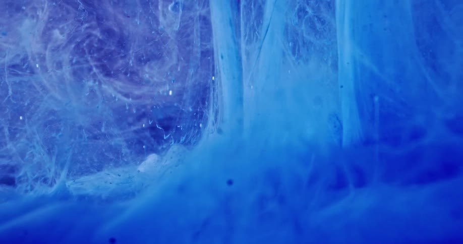 Bubbles rise as liquid dye is poured in to water