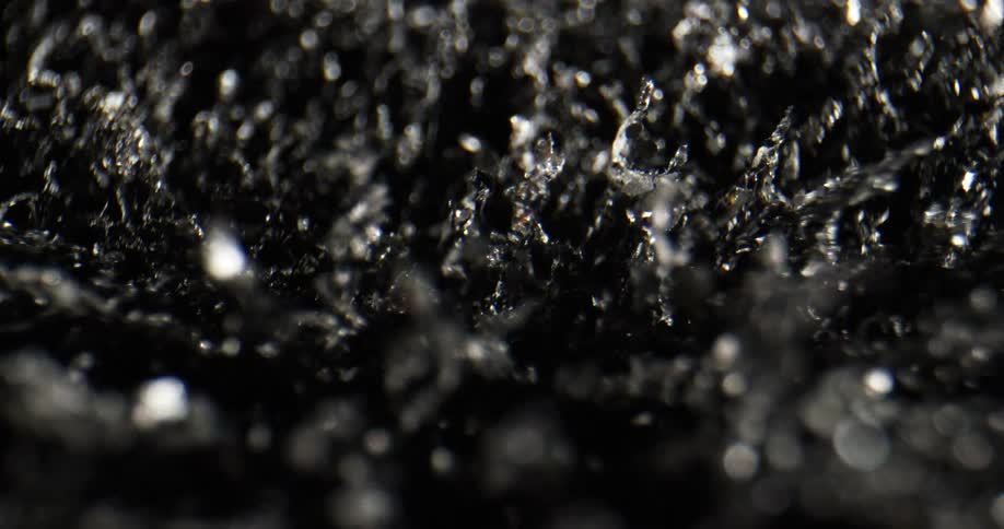 Close up of thin silver pieces moving around in circles