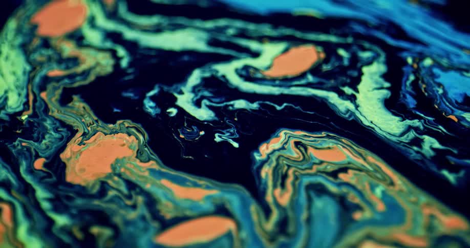 Close up of a painting with colors mixing together