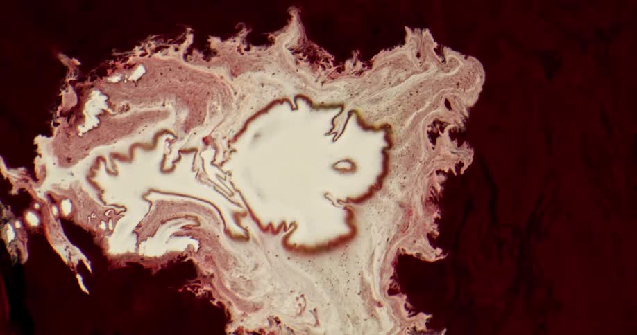 Abstract footage of liquid mixing together