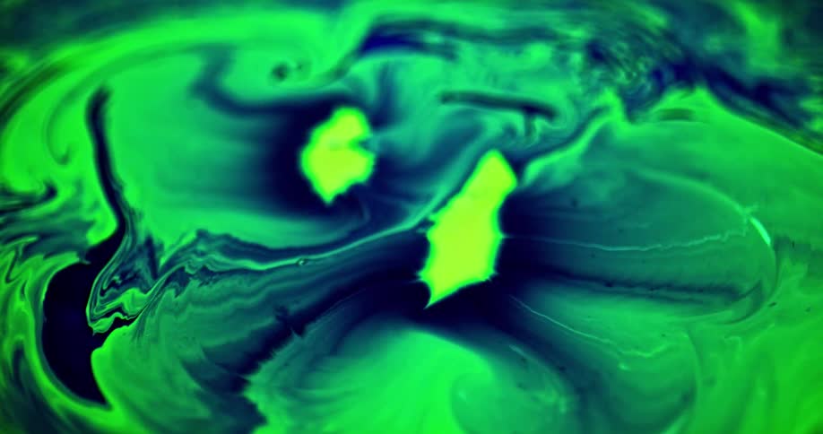 Blue and green liquids are mixing together