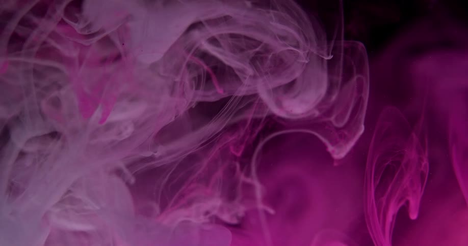 Wisps and clouds of purple float and swirl against black
