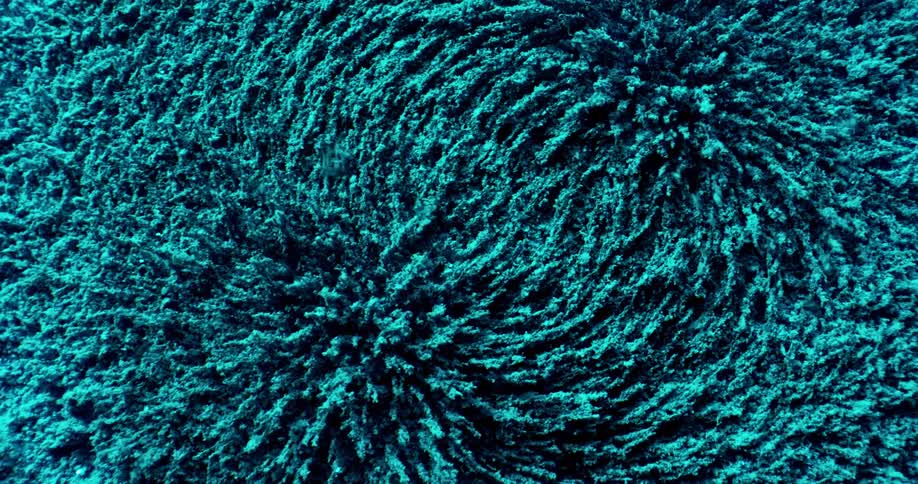 A time lapse of teal fibers moving