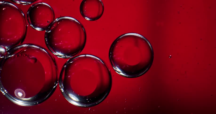 A close up of bubbles bouncing and popping