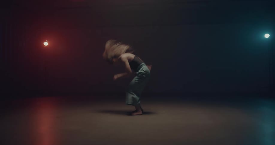 A woman dancing indoors