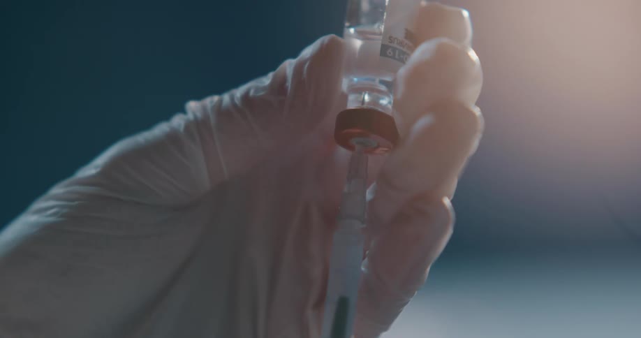 A syringe being filled with covid19 vaccine