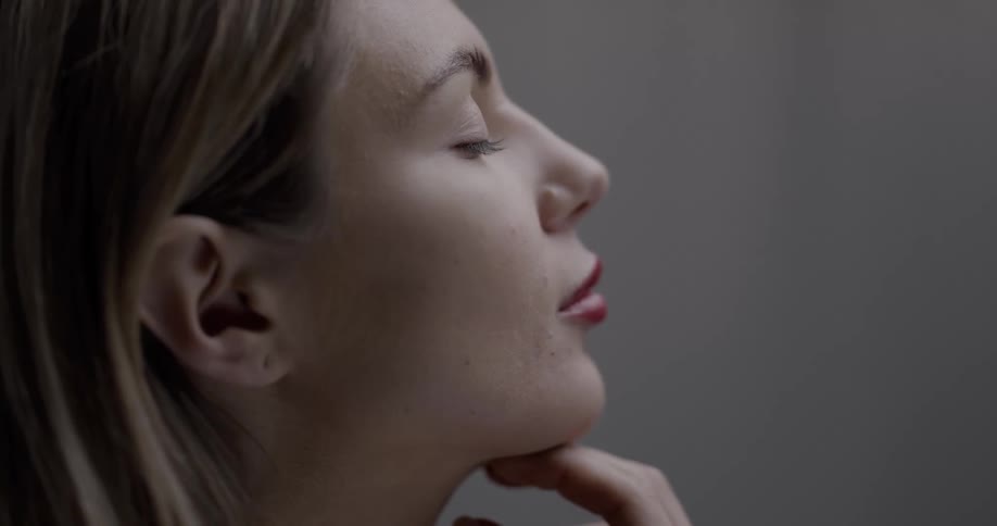 A woman opens her eyes