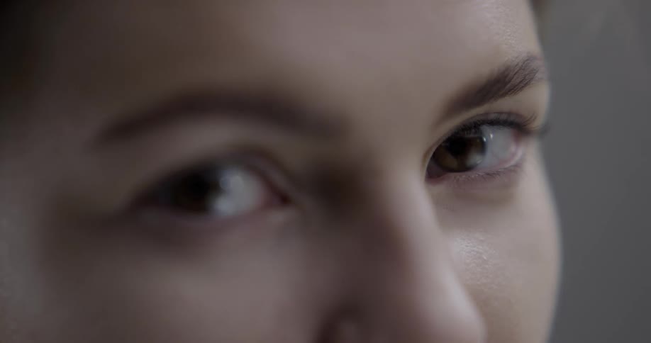 Woman stares in one direction then turns her eyes forward