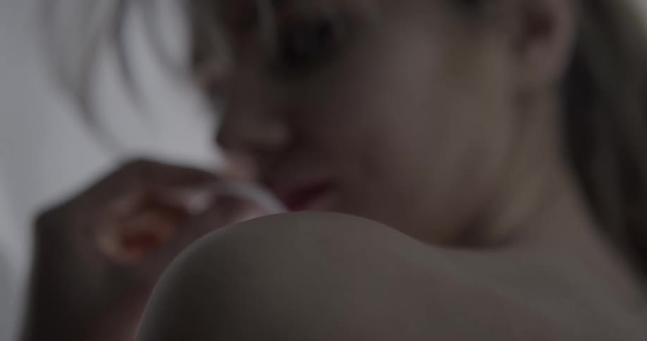 A close up of a woman moving seductively