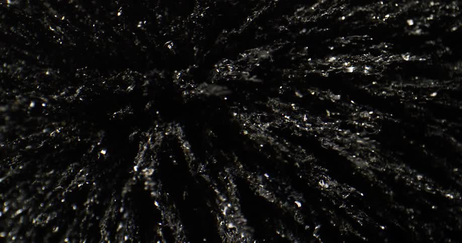 Black textured shapes pointing upwards move around in a circle